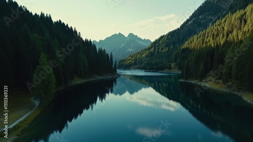 Serene mountain lake reflecting peaks and lush forests in a tranquil landscape at dusk