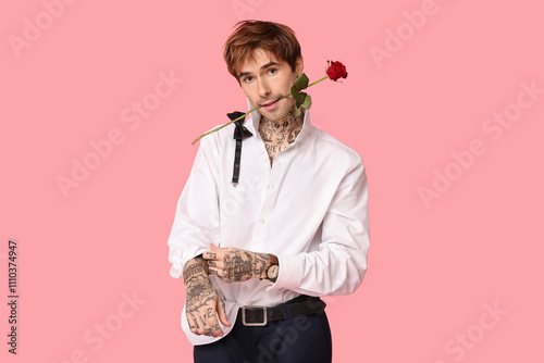 Stylish young man with tatt...