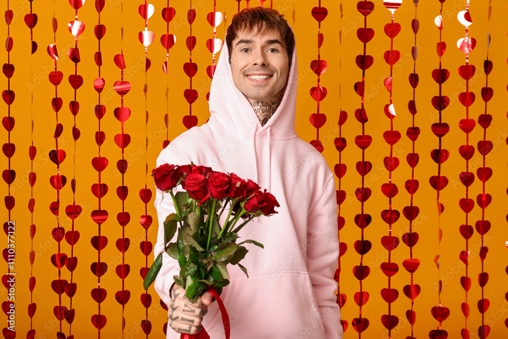 Εκτύπωση καμβά Handsome young man with bouquet of roses and hearts curtain on yellow background