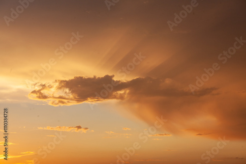 Twilight in Sviyazhsk unveils stunning clouds illuminated by the suns warm descent, creating a breathtaking display. photo