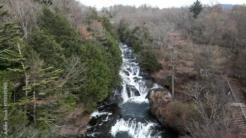 Wildwaterfall flowing through colorful autumn landscape