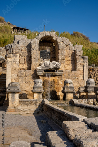 Rows of columns in Perge, Antalya, Turkey. Remains of colonnaded street in Pamphylian ancient city.Rows of columns in Perge, Antalya, Turkey. Ancient Kestros Fountain. Aksu, Antalya photo