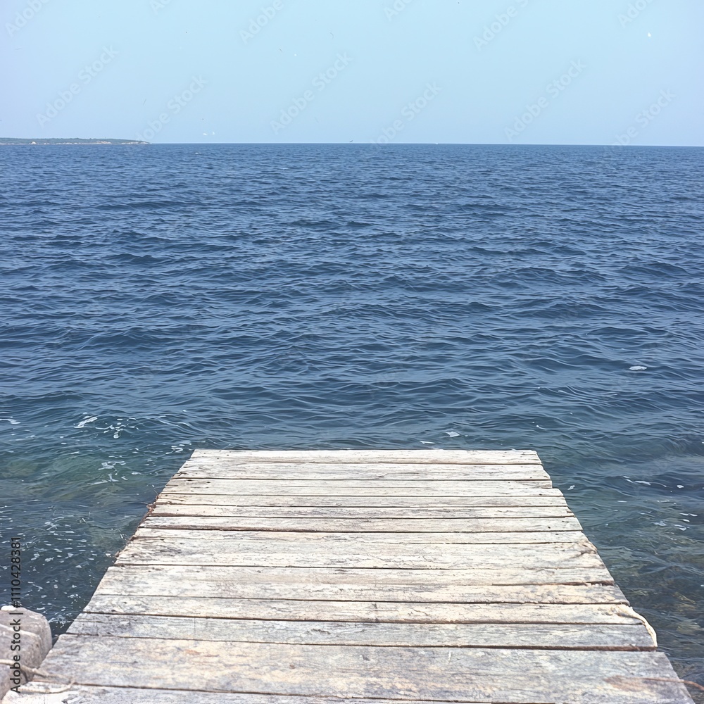 Fototapeta premium Tranquil ocean view from wooden dock.