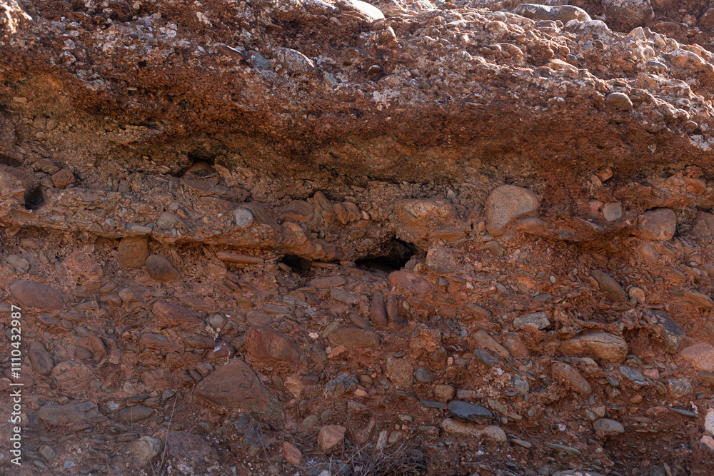 Natural layers of sedimentary rocks showcasing erosion, in the arid region 50 km from Marrakech.