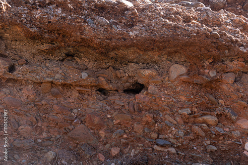 Obraz na płótnie Natural layers of sedimentary rocks showcasing erosion, in the arid region 50 km from Marrakech. w salonie