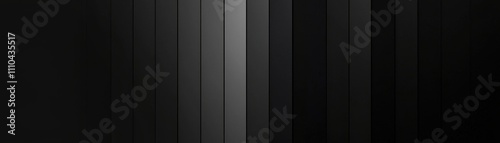 A minimalistic, abstract image featuring vertical stripes in varying shades of black and gray, creating a modern, textured appearance.