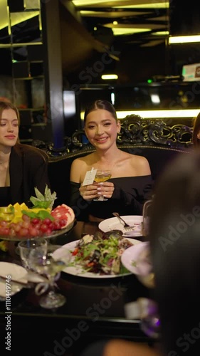Women are sitting at table in restaurant. Concept of feast in restaurant.