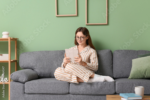 Young woman in pajamas and ...