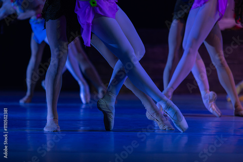 Closeup of ballerinas dancing on stage.