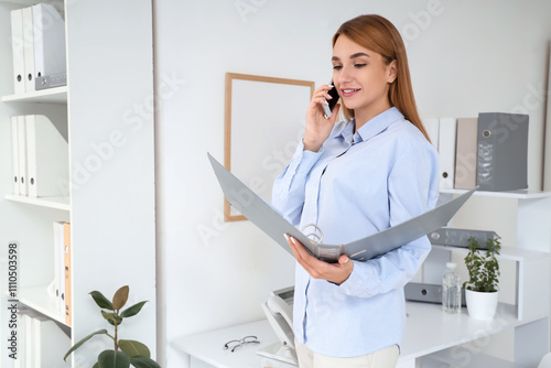 Young businesswoman with do...