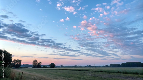 a sunset with clouds and a sunset in the sky1 photo