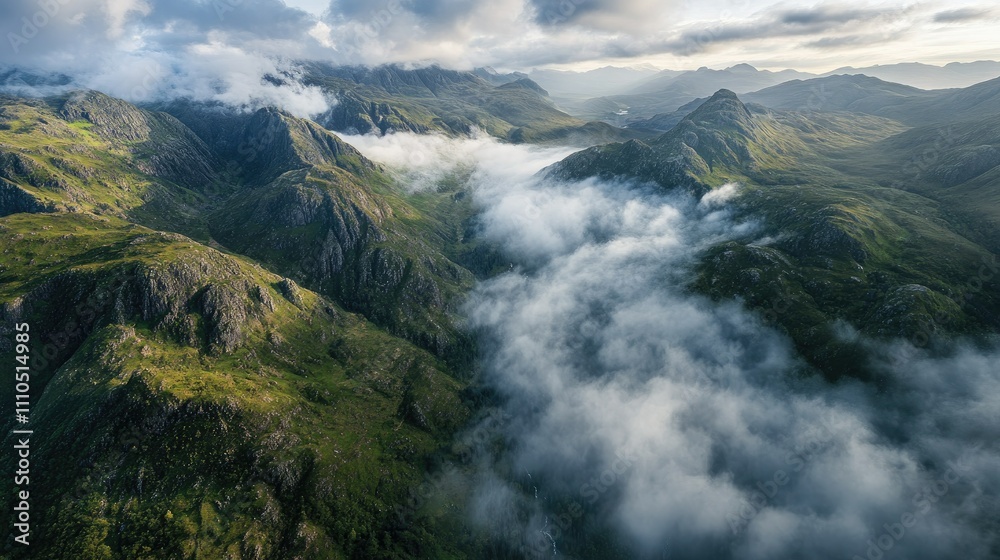 A panoramic aerial view of Glencoe and its dramatic mountain ranges, with misty clouds hovering over the valleys, capturing the essence of the Scottish Highlands A panoramic aerial view of Glencoe and its dramatic mountain ranges, with misty clouds hovering over the valleys, capturing the essence of the Scottish Highlands