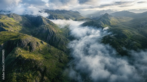 A panoramic aerial view of Glencoe and its dramatic mountain ranges, with misty clouds hovering over the valleys, capturing the essence of the Scottish Highlands