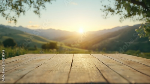 A serene landscape at sunrise, featuring a wooden table in the foreground and rolling hills bathed in golden light.