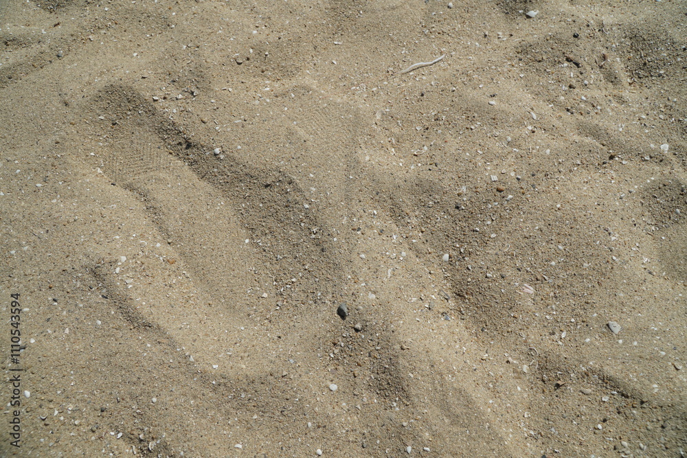 Beige Beach Sand with delicate textures and sun flare on surface, fine sandy beach at sunlight, minimal nature backdrop, calm concept, natural shore ocean or sea close up texture outdoor. Beige Beach Sand with delicate textures and sun flare on surface, fine sandy beach at sunlight, minimal nature backdrop, calm concept, natural shore ocean or sea close up texture outdoor.