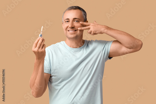Happy mature man holding pi...