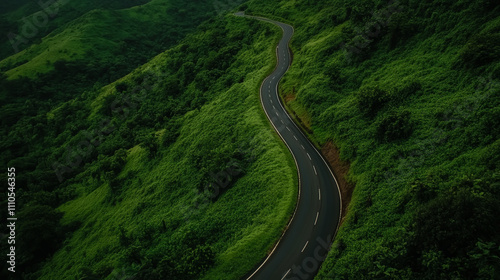 Isolated asphalt road winding through lush green hills, scenic landscape view photo