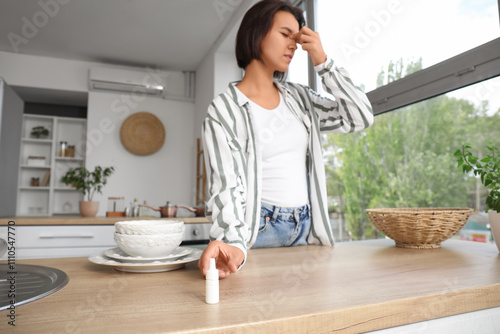 Tired young woman taking ey...