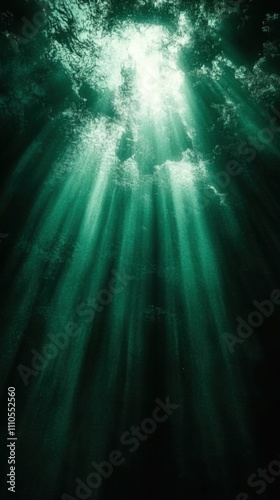 Captivating Underwater Scene with Sunlight Filtering Through Water Surface Creating a Serene Atmosphere Beneath the Ocean in Deep Shades of Green and Blue Hues