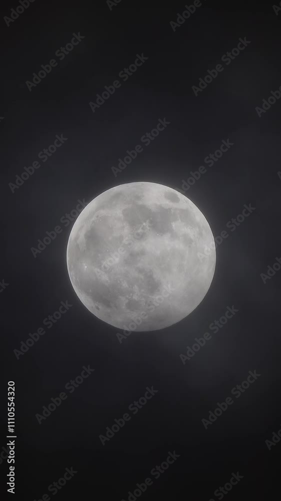 full moon moving between clouds. Vertical video full moon moving between clouds. Vertical video