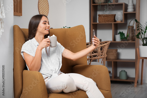 Young woman with cocoa and ...