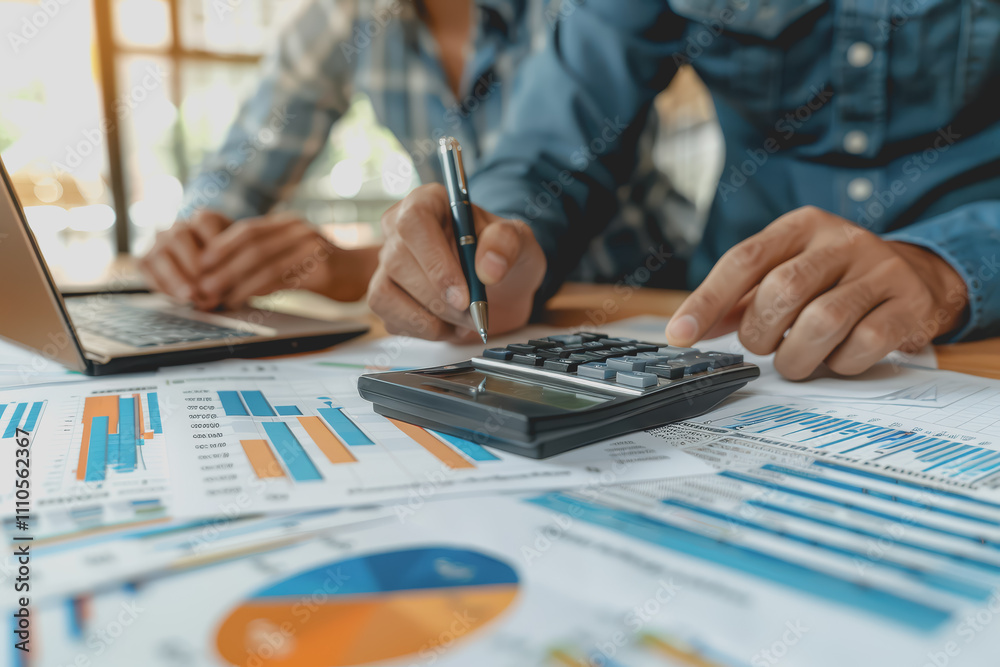 Business team meeting using chart calculator and analyzing business strategy financial statistics. Business team meeting using chart calculator and analyzing business strategy financial statistics.