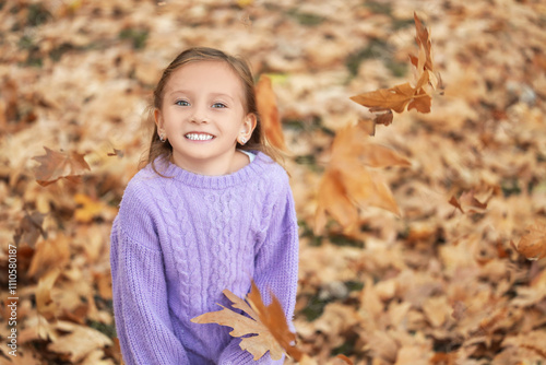 Cute little happy girl thro...