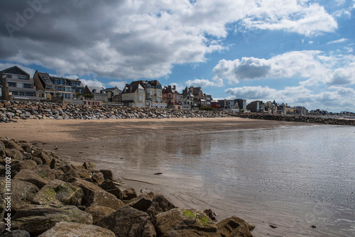 Typical houses by the beach in the town of Agon in Normandy, France photo