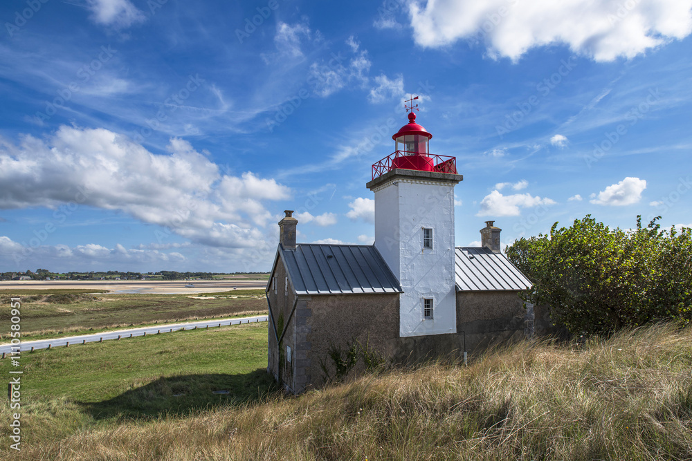 Red and white lighthouse at the Pointe d'Agon in Normandy, France Red and white lighthouse at the Pointe d'Agon in Normandy, France