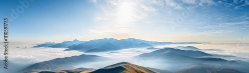 Panoramic view of Carpathian Mountains with sun rays, rolling hills, and majestic peaks under a blue sky.