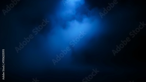  A beam of cold blue spotlight on a dark, empty stage, the room shrouded in a thick layer of blue fog. An abstract combination of smoke textures and lighting.



