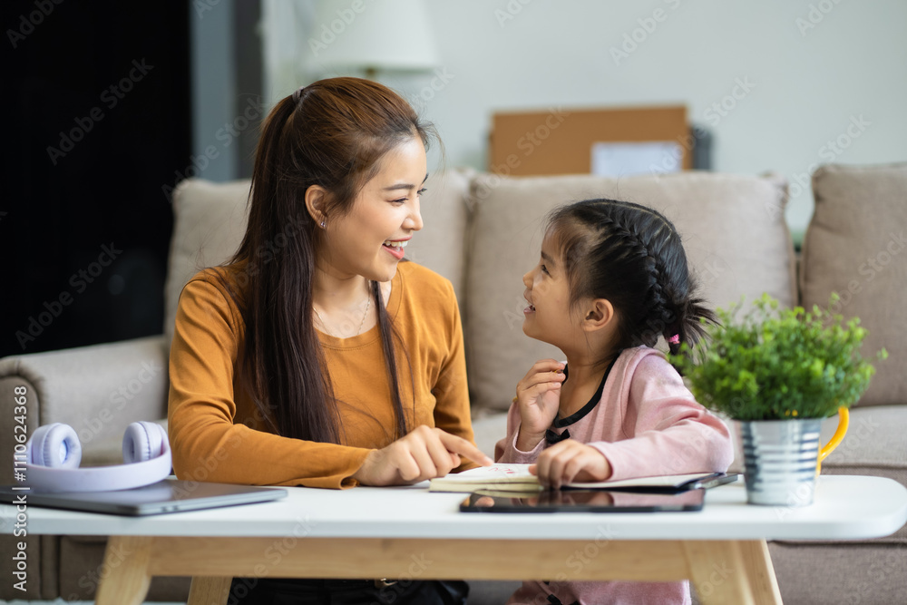 Mother and daughter spend their holiday in the living room at home. Mother and daughter spend their holiday in the living room at home.