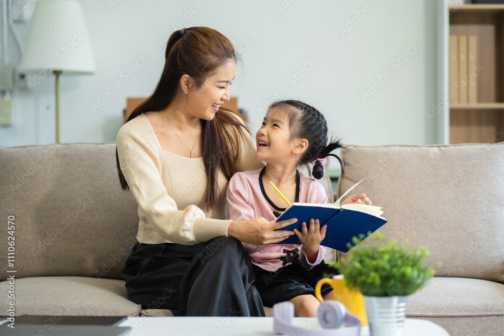 Mother and daughter spend their holiday in the living room at home. Mother and daughter spend their holiday in the living room at home.