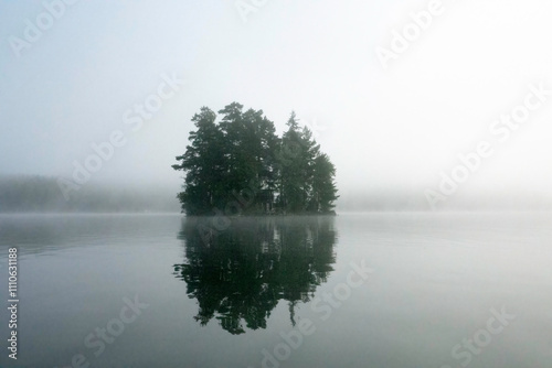Misty morning at a lake during sunrise