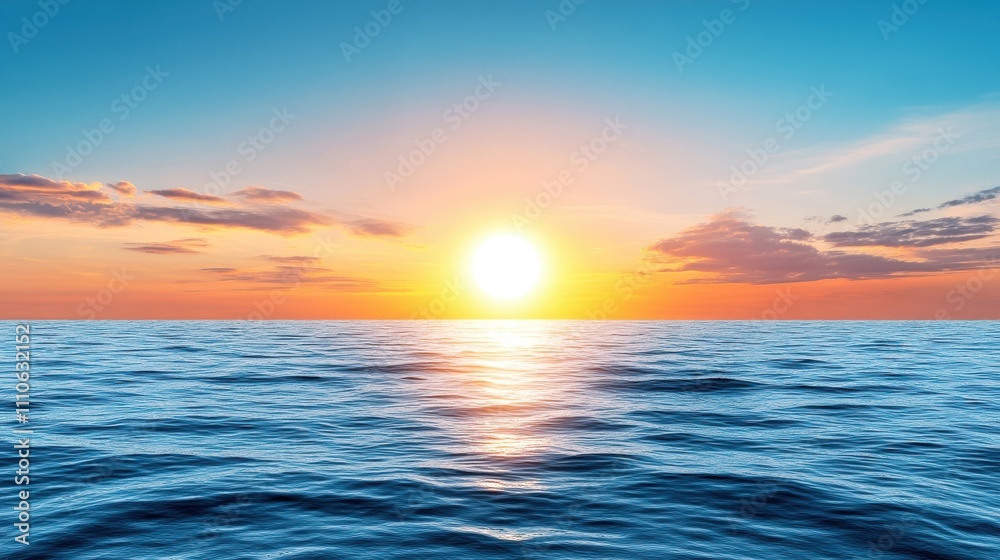 Obraz premium Vibrant sunset over tranquil ocean waters, reflecting warm colors in a serene landscape image.