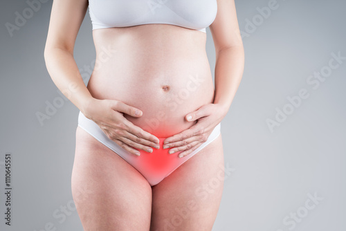 Wallpaper Mural Pregnant woman with abdominal pain, risk of premature birth, gray background Torontodigital.ca