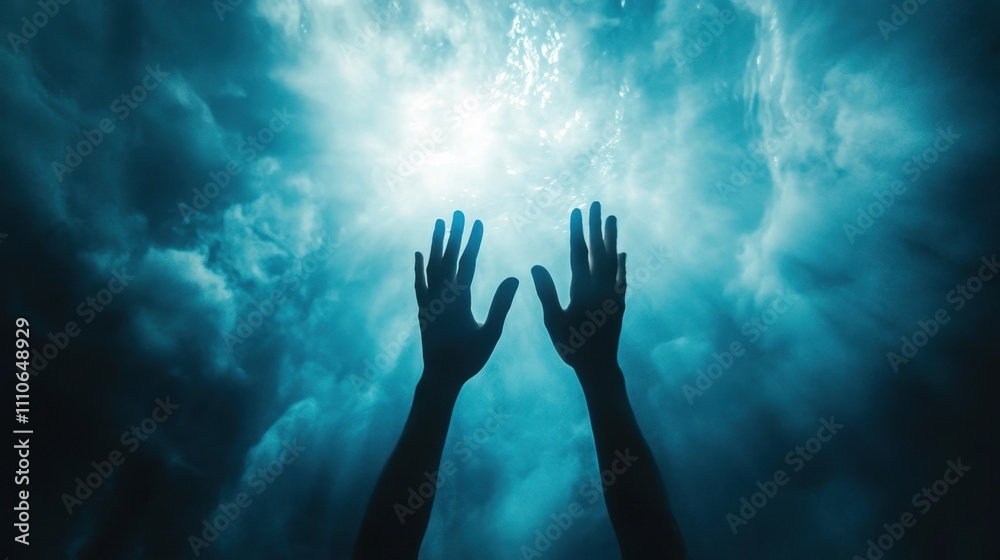 A scene of spiritual worship with silhouetted hands reaching up against a serene blue backdrop. A scene of spiritual worship with silhouetted hands reaching up against a serene blue backdrop.