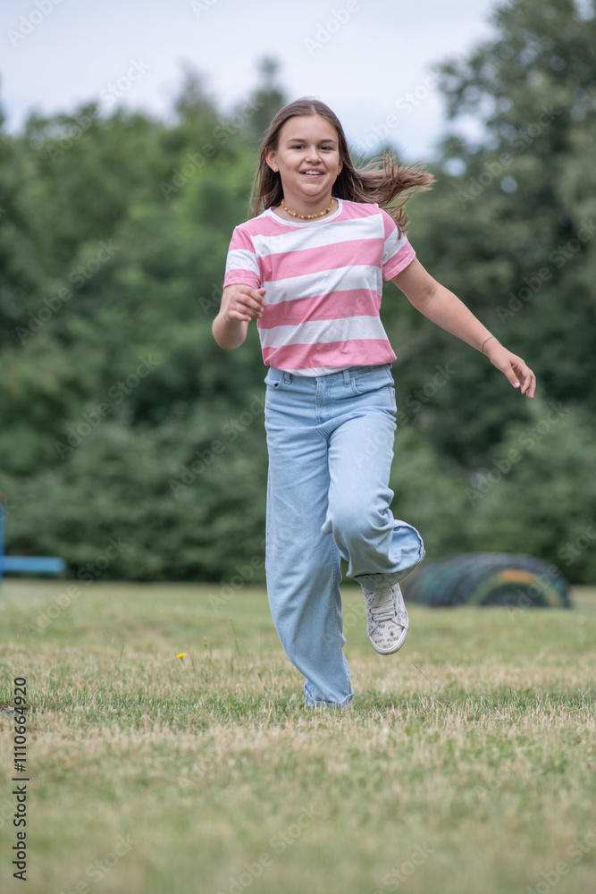 A young beautiful girl frolics in a summer park. A young beautiful girl frolics in a summer park.