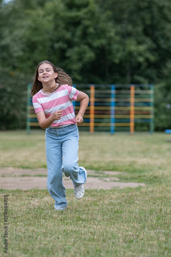 A young beautiful girl frolics in a summer park. A young beautiful girl frolics in a summer park.