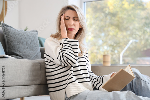 Mature woman with book expe...