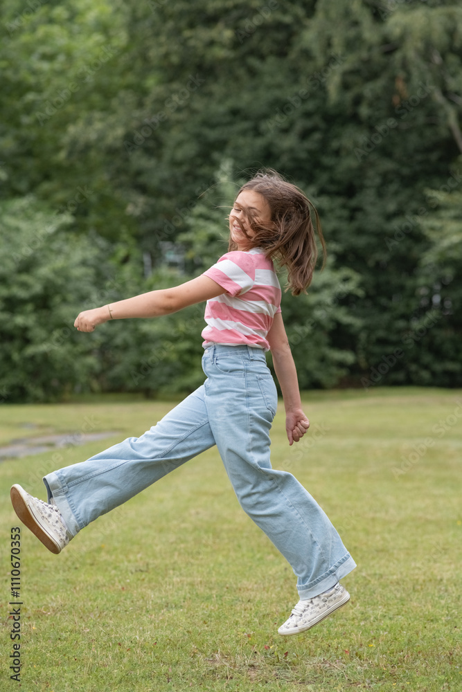 A young beautiful girl frolics in a summer park. A young beautiful girl frolics in a summer park.