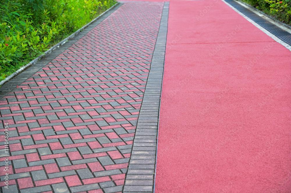 Obraz premium Close-up of the jogging track in the public park in Hong Kong. Public park scene, healthy activity.