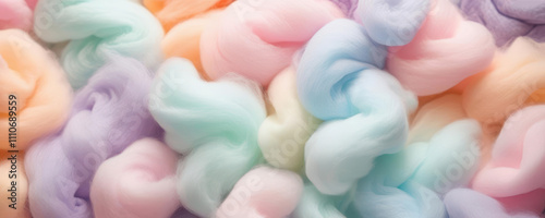 Pastel-colored fluffy cotton candy clouds create a soft, dreamy texture for backgrounds. Featuring hues of pink, blue, and purple, this design evokes sweetness and joy.