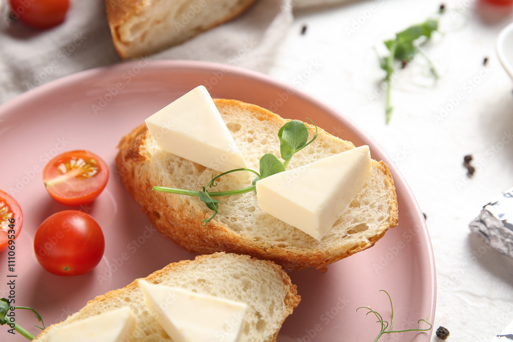Plate with bread, triangles of tasty processed cheese, tomatoes and micro green on light table, closeup Plate with bread, triangles of tasty processed cheese, tomatoes and micro green on light table, closeup