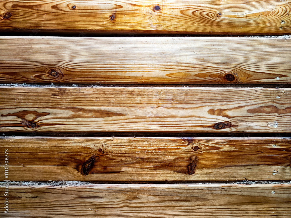 Naklejka premium Warm wooden planks with natural grain patterns create inviting texture for design use