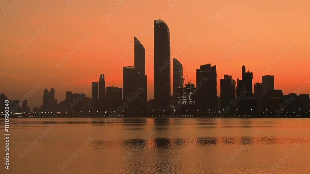 Beautiful sunrise in Abu Dhabi, United Arab Emirates, casting a golden glow over the city’s skyline and serene waters. A breathtaking view of nature meeting modern architecture. Beautiful sunrise in Abu Dhabi, United Arab Emirates, casting a golden glow over the city’s skyline and serene waters. A breathtaking view of nature meeting modern architecture.