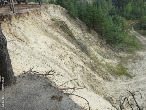 steep sandy cliff in the Lopatinsky quarries in the Moscow region photo
