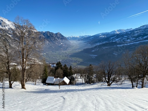 Winter atmosphere in spacious subalpine valley Seeztal along the Seez River between Lake Walensee and the Rheintal Valley, Walenstadtberg - Canton of St. Gallen, Switzerland (Schweiz) photo