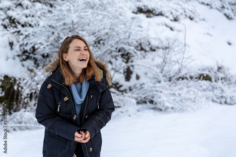 A Joyful Woman is Delightfully Enjoying the Beautiful Snowy Winter Landscape Around Her A Joyful Woman is Delightfully Enjoying the Beautiful Snowy Winter Landscape Around Her