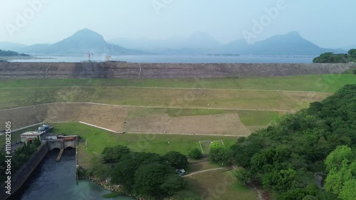 Established Aerial View of Jatiluhur, the Largest Dam in Indonesia. Multi-Purpose Embankment Dam on The Citarum River with Morning Glory Spillway photo